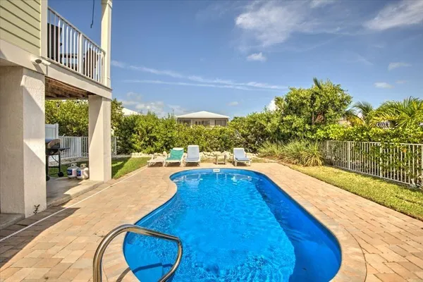a view of swimming pool from a balcony