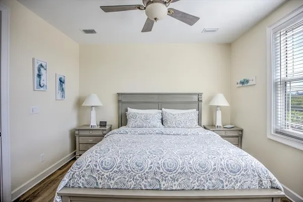 a bedroom with a bed and window