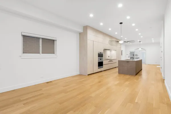 a view of a kitchen with a sink and a microwave