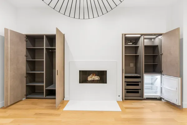 a view of an empty room with shelves