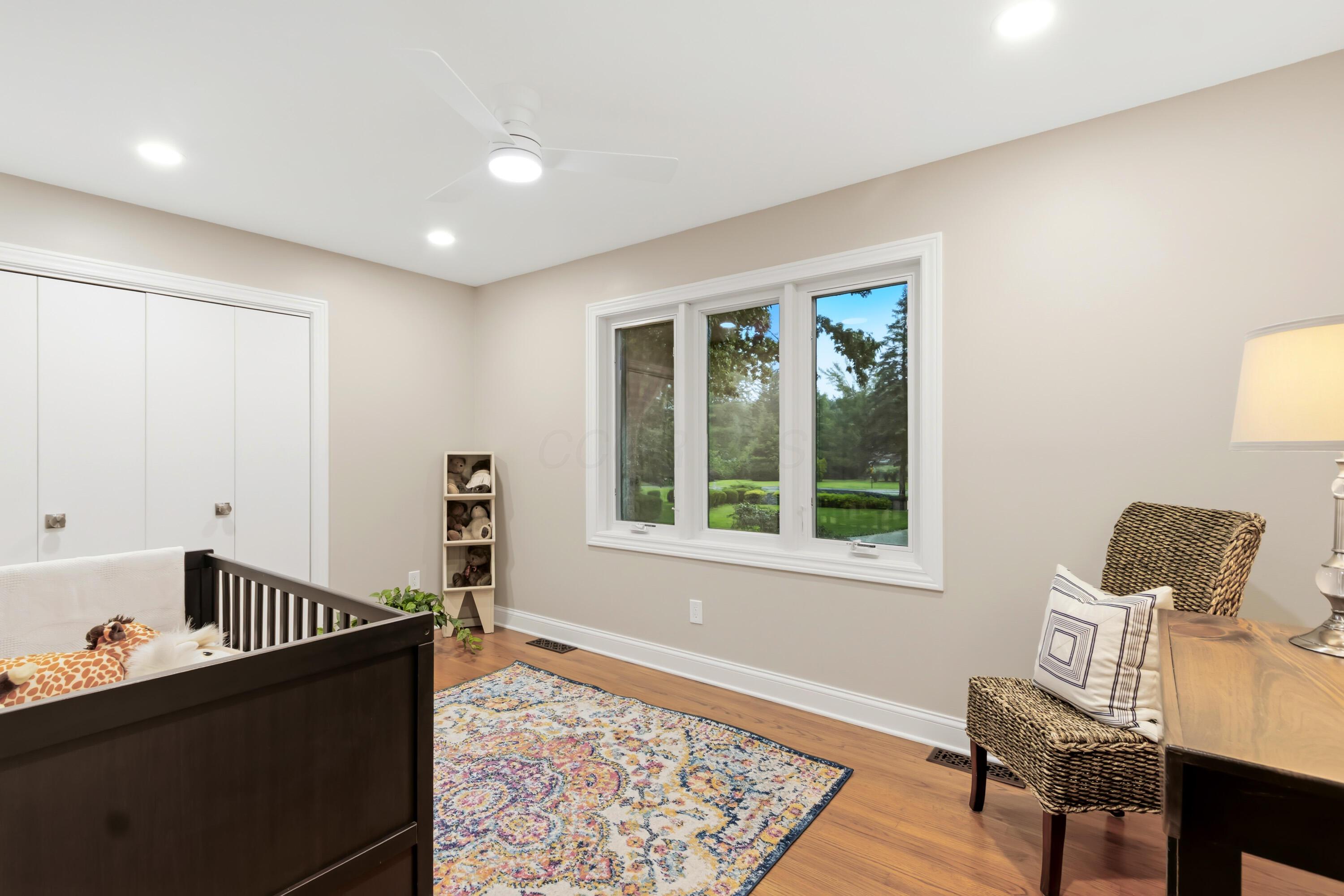 1560 Carriage Road Powell, OH 43065 - Photo 46 of 73 Wood-finish flooring, recessed lighting, ceiling fan, and white trim