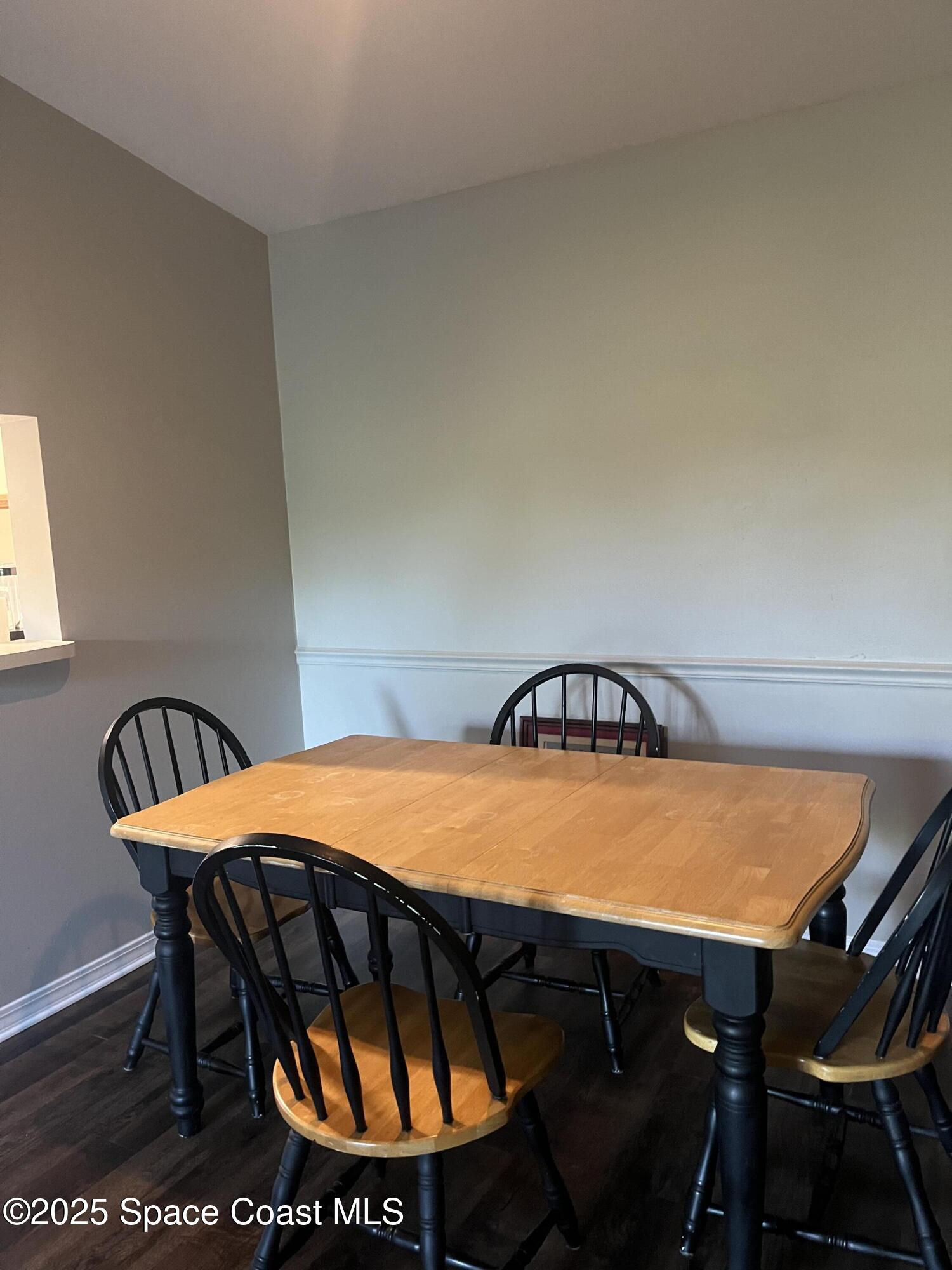 7667 North Wickham Road, Unit 1118 Melbourne, FL 32940 - Photo 5 of 17 a view of a swimming pool with a table and chairs