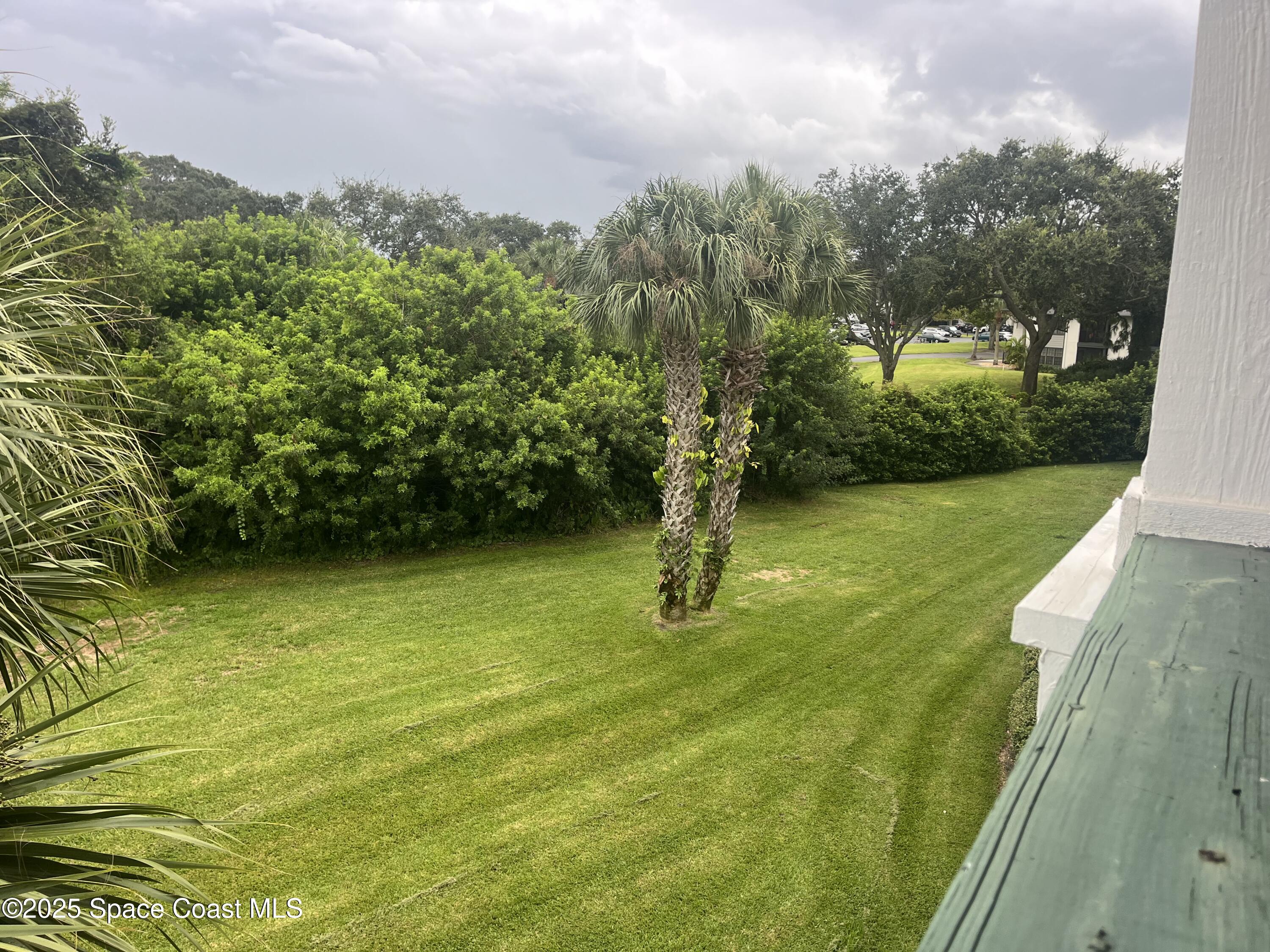 7667 North Wickham Road, Unit 1118 Melbourne, FL 32940 - Photo 9 of 17 a view of an outdoor space and a yard