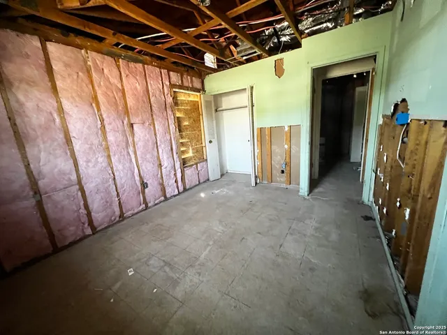 a view of a room with stainless steel appliances