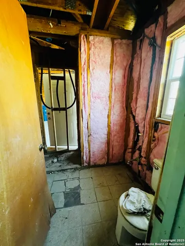 a bathroom with a toilet and a sink