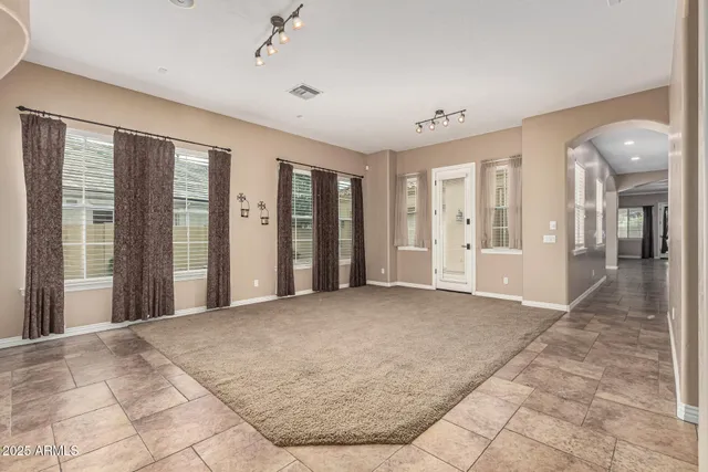 a view of an empty room with glass door