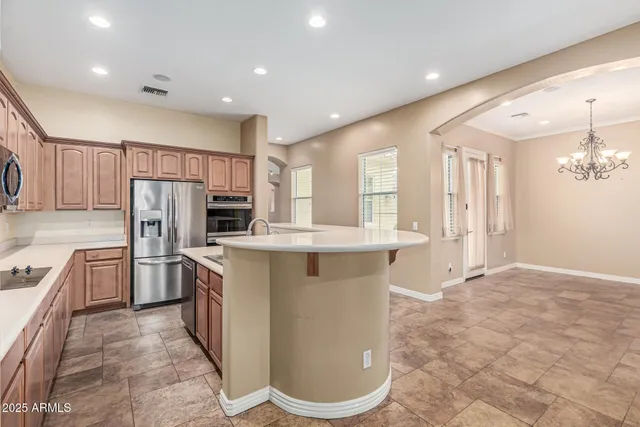 a kitchen with refrigerator cabinets and outdoor space