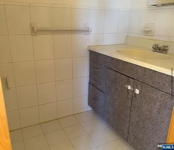 a bathroom with a sink and a shower