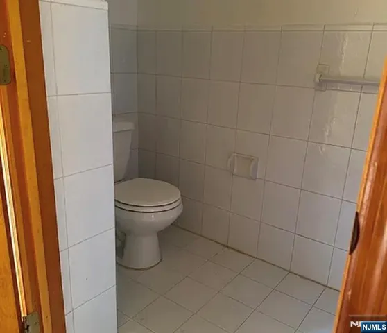 a bathroom with a toilet and a sink