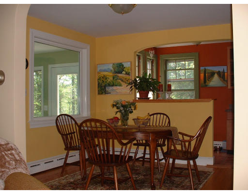 103 Gould Road Andover, MA 01810 - Photo 4 of 11 a view of a dining room with furniture and a potted plant