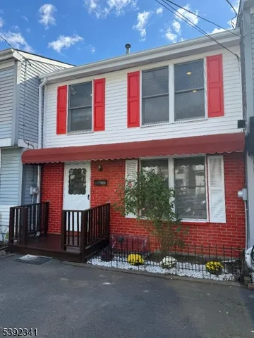 a view of a house with a yard and balcony