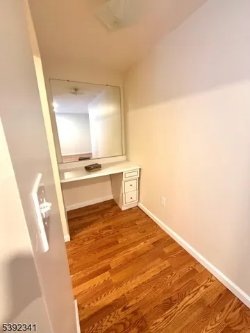 a view of a hardwood & utility room