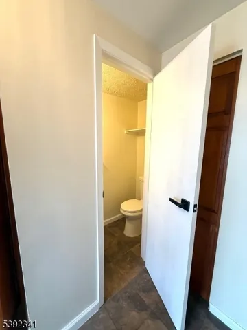 a view of a bathroom with a toilet