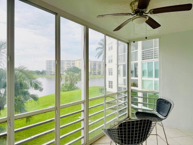 3051 North Course Drive, Unit 209 Pompano Beach, FL 33069 - Photo 4 of 17 a room with window and furniture