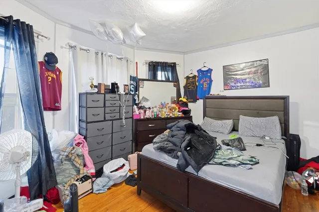a living room with furniture and a bed