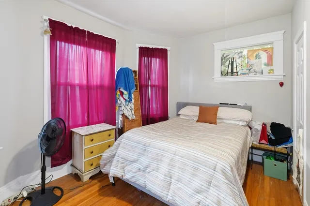 a bedroom with a bed and a closet