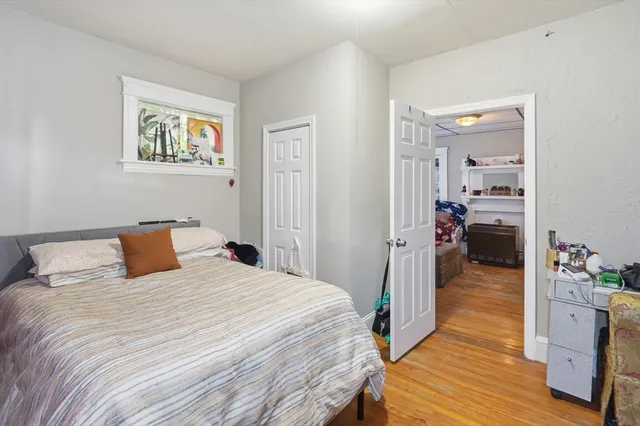 a bedroom with a bed and a view of bedroom