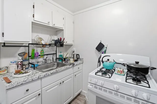 a kitchen with a sink and cabinets