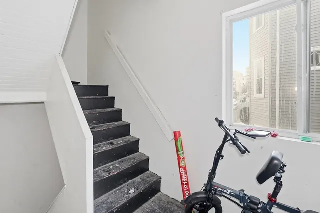 a view of entryway with wooden floor