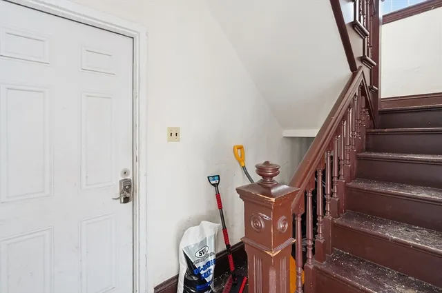 a view of an entryway with wooden floor