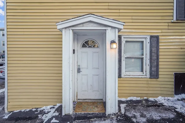 a view of a house with a door and a window
