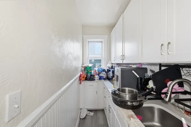 a kitchen with a stove and a sink