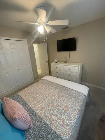 a kitchen with granite countertop a counter space cabinets and stainless steel appliances