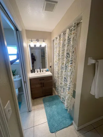 a bathroom with a sink a vanity and a mirror