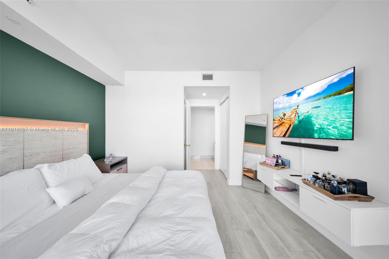 45 Southwest 9th Street, Unit 3909 Miami, FL 33130 - Photo 20 of 23 a bedroom with a bed and a flat screen tv