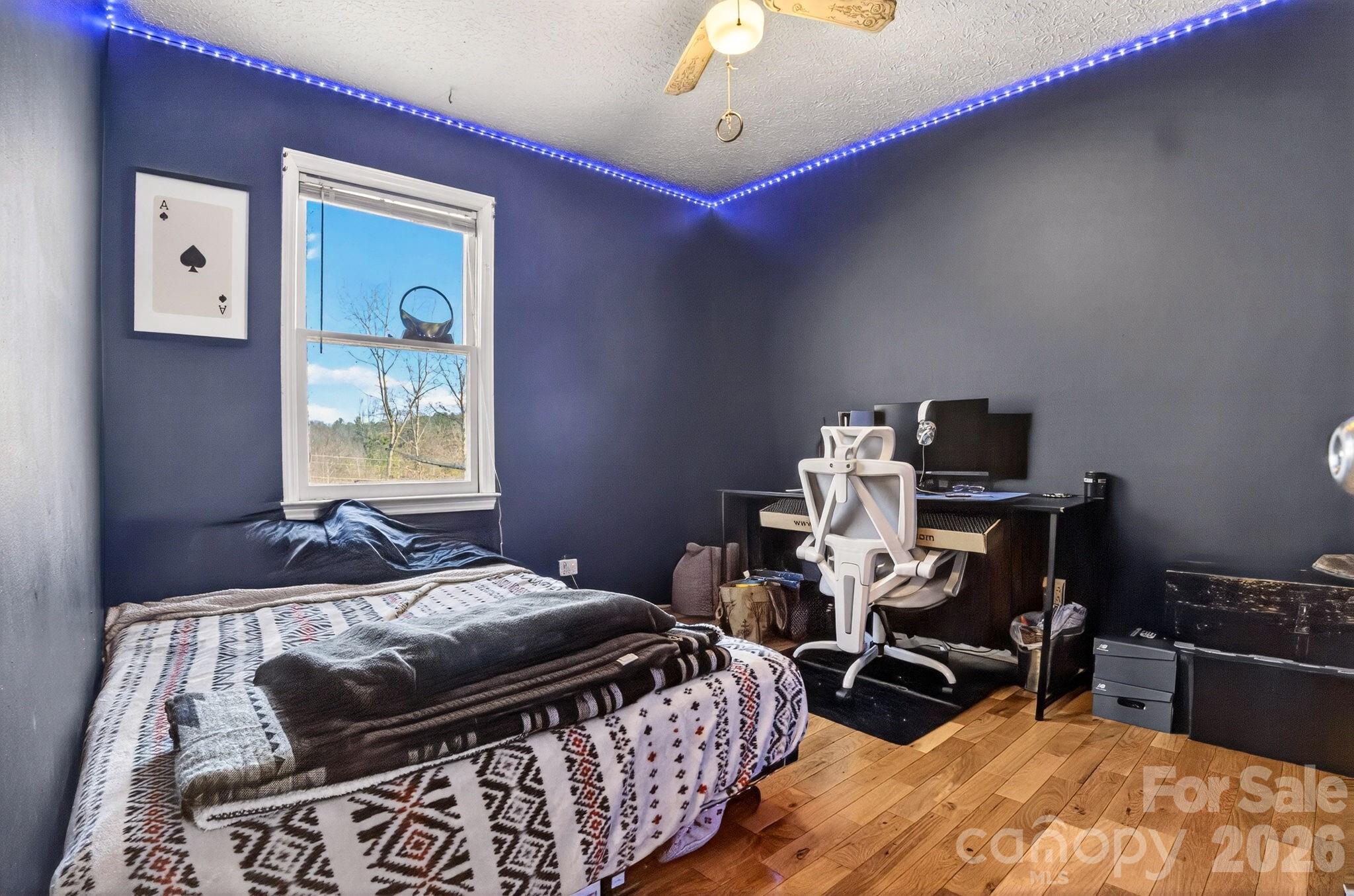 225 Baxter Street Morganton, NC 28655 - Photo 11 of 22 a bedroom with bed and a window