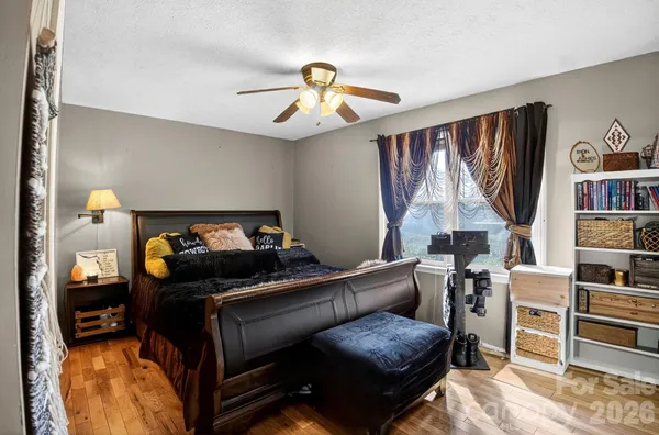 a bedroom with furniture and a window