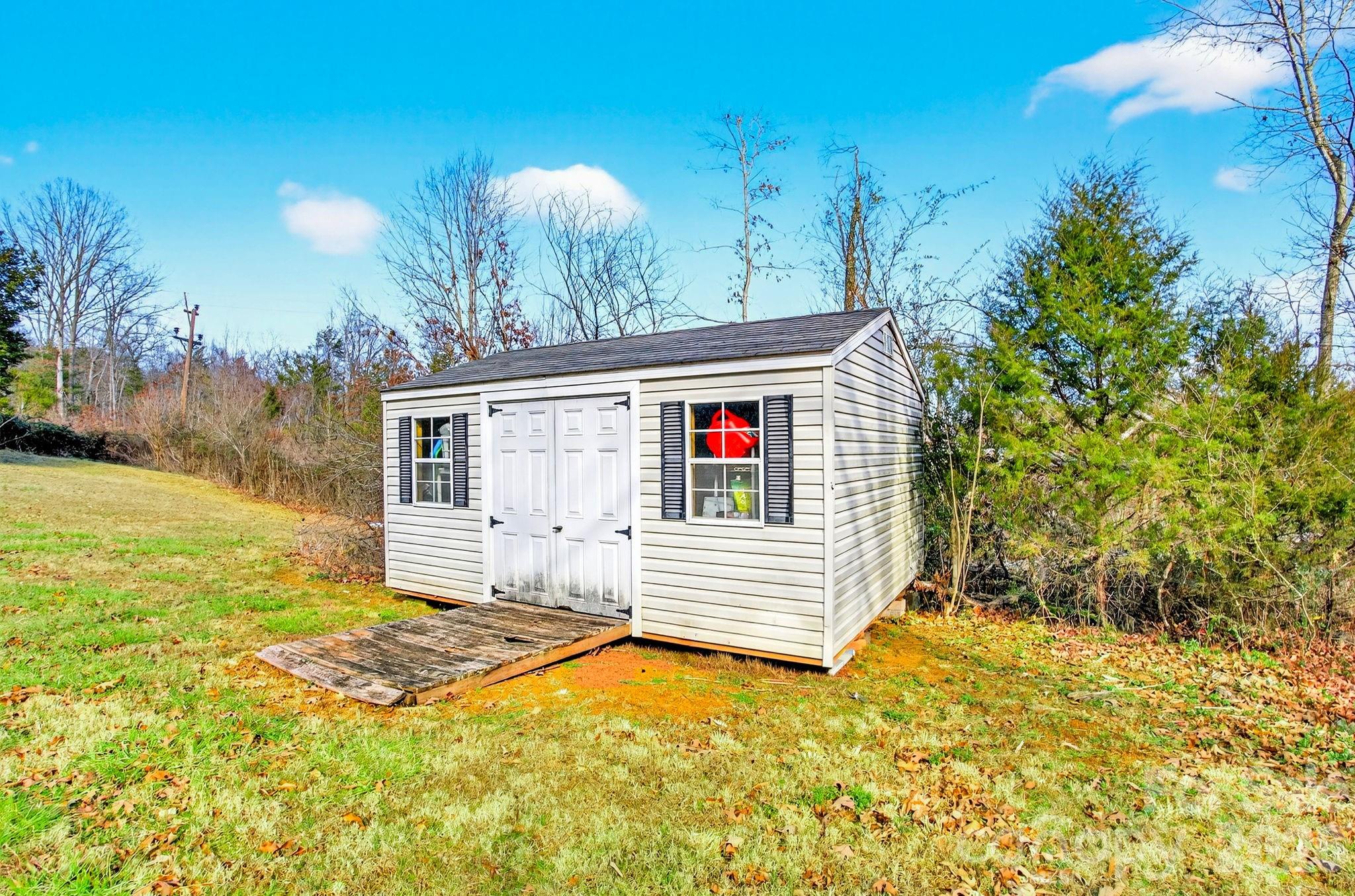 225 Baxter Street Morganton, NC 28655 - Photo 21 of 22 a front view of a house with a yard