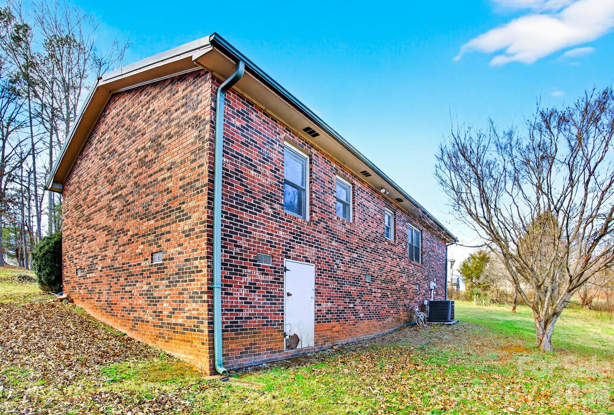 225 Baxter Street Morganton, NC 28655 - Photo 22 of 22 a view of a house with a yard