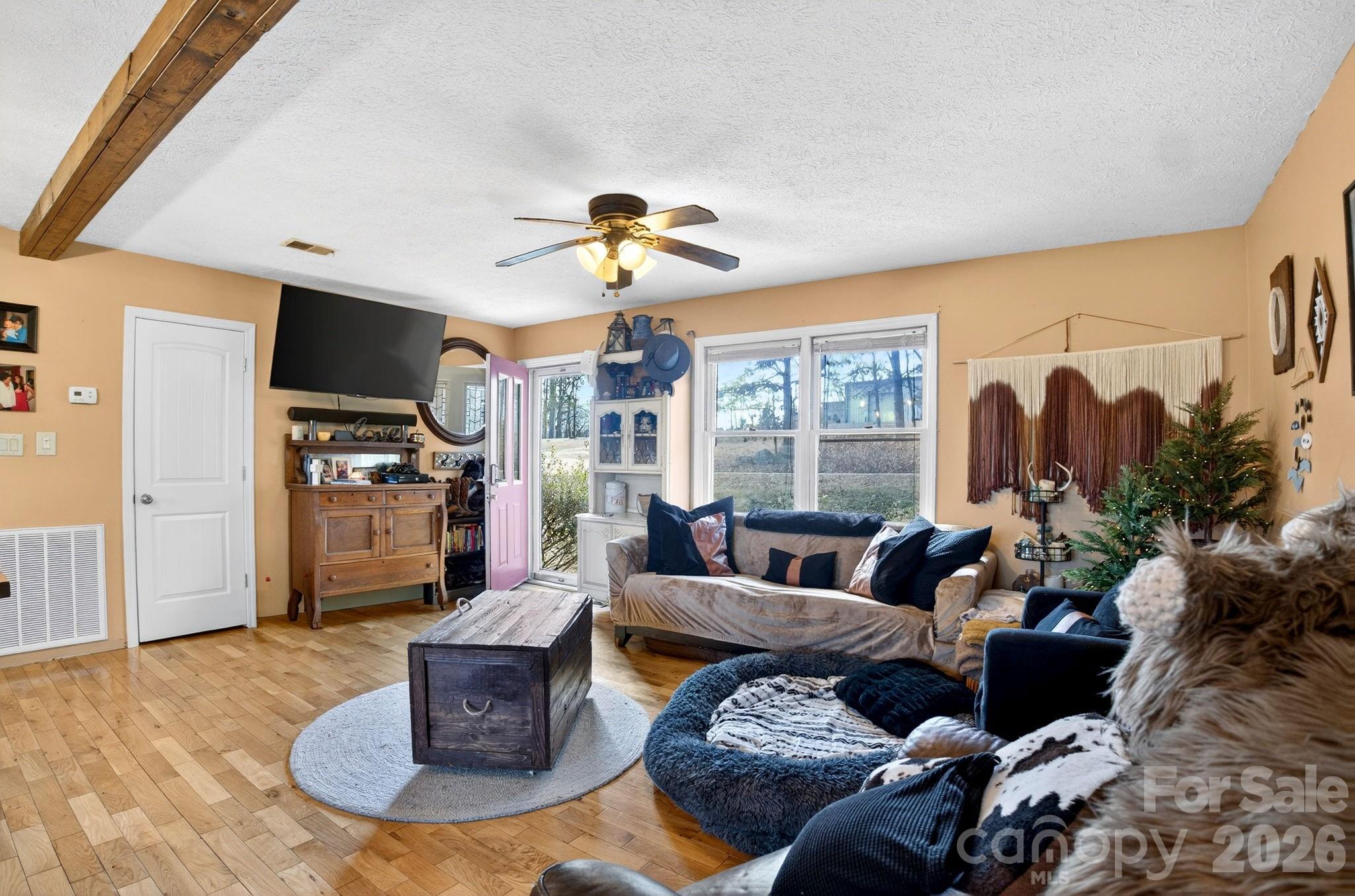 225 Baxter Street Morganton, NC 28655 - Photo 5 of 22 a living room with furniture fireplace and a large window