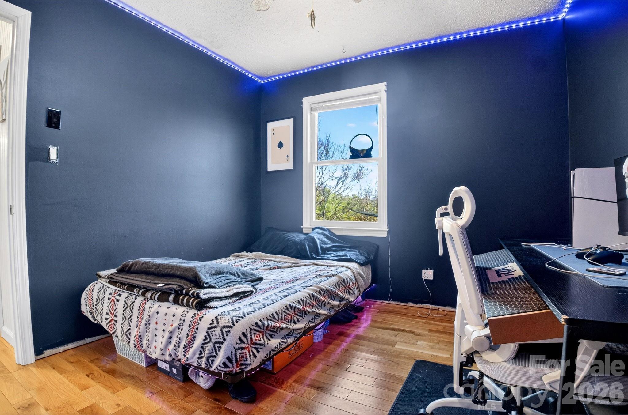 225 Baxter Street Morganton, NC 28655 - Photo 10 of 22 a bedroom with a bed and a desk