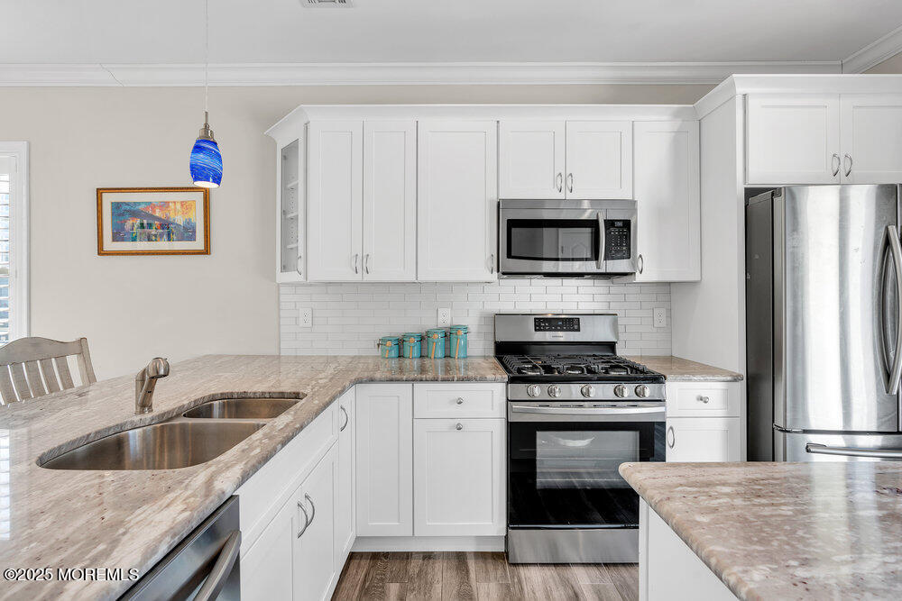 17 Green Tree Circle Hazlet, NJ 07730 - Photo 11 of 29 a kitchen with granite countertop a sink stove and refrigerator