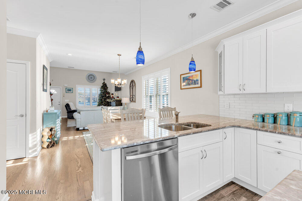17 Green Tree Circle Hazlet, NJ 07730 - Photo 12 of 29 a kitchen with kitchen island granite countertop a sink cabinets and stainless steel appliances