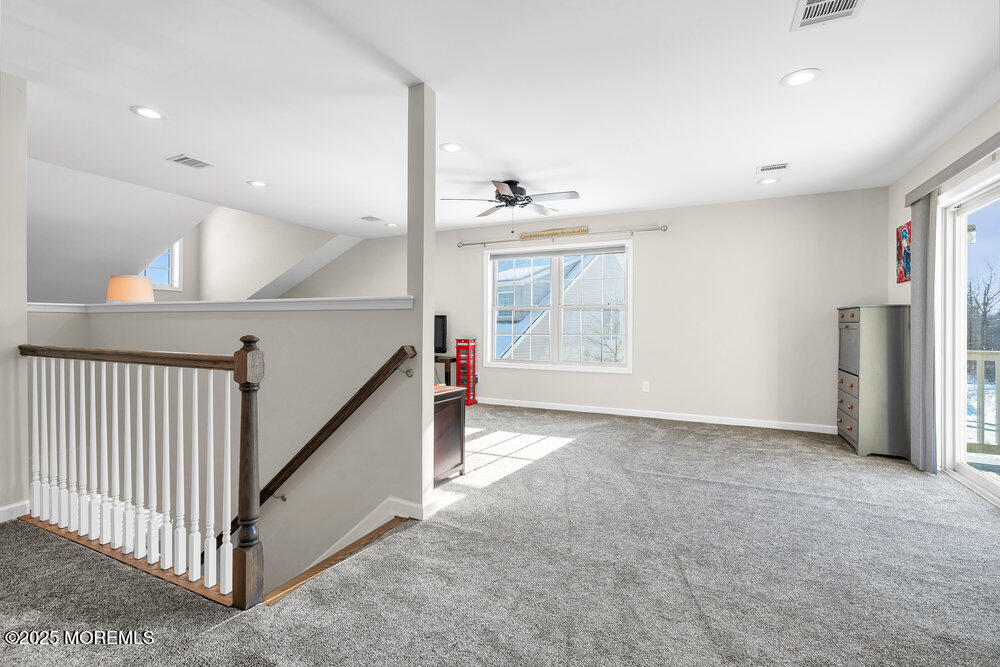 17 Green Tree Circle Hazlet, NJ 07730 - Photo 18 of 29 a view of an empty room with a window