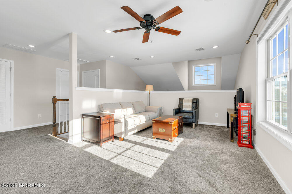 17 Green Tree Circle Hazlet, NJ 07730 - Photo 20 of 29 a living room with furniture a window and a flat screen tv