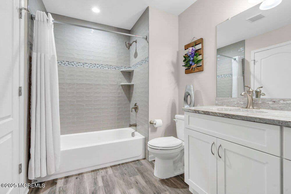 17 Green Tree Circle Hazlet, NJ 07730 - Photo 23 of 29 a bathroom with a granite countertop sink a toilet and shower