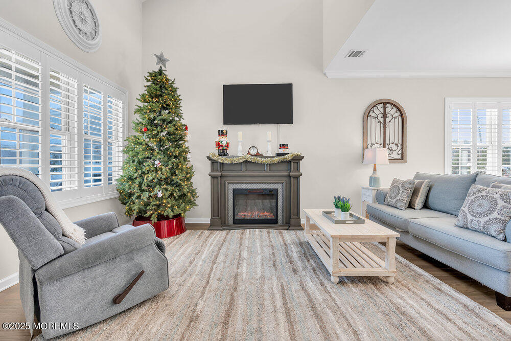 17 Green Tree Circle Hazlet, NJ 07730 - Photo 5 of 29 a living room with furniture a fireplace and a flat screen tv