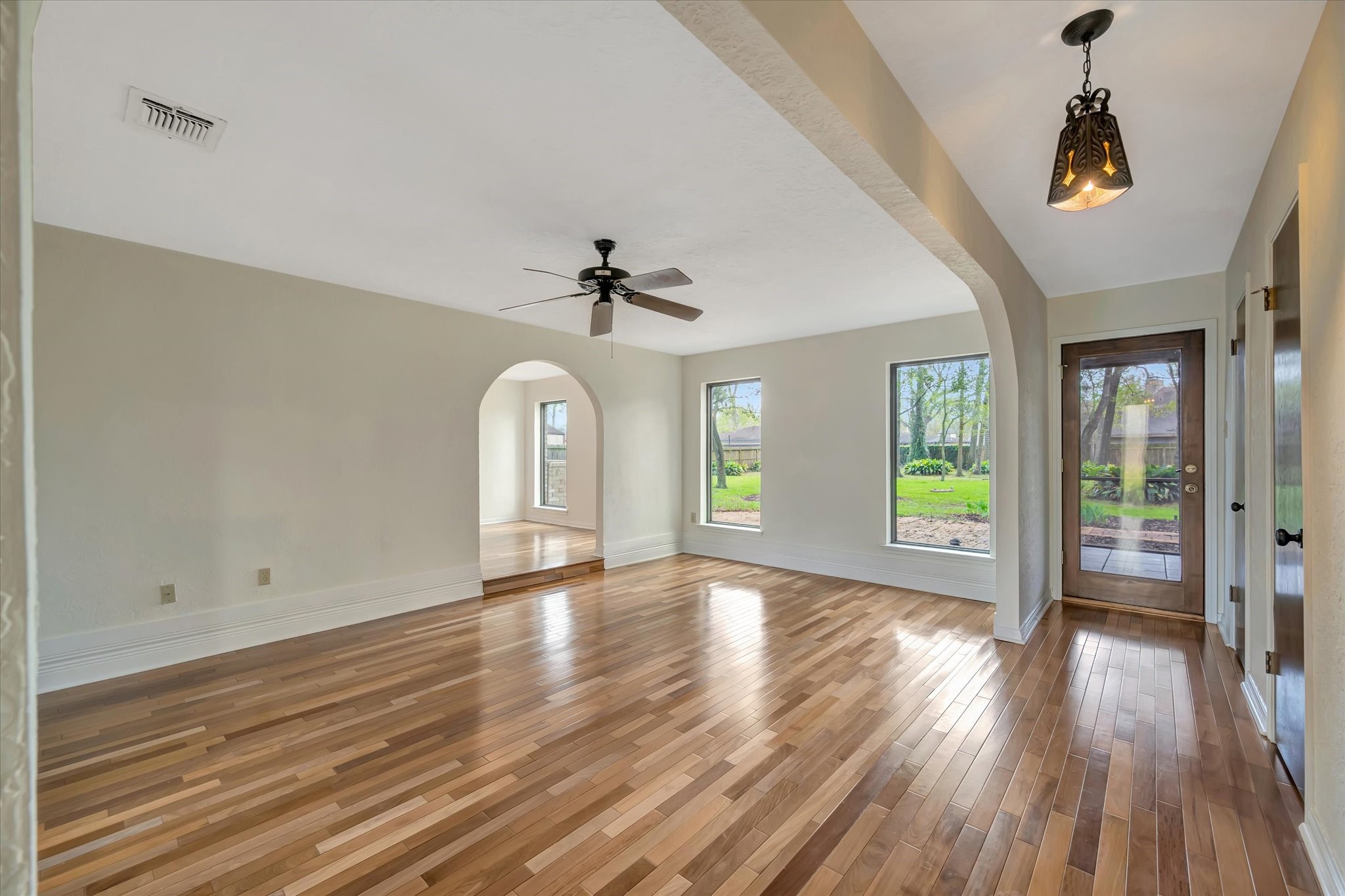 822 Devonport Lane Seabrook, TX 77586 - Photo 14 of 50 a view of empty room with wooden floor and fan