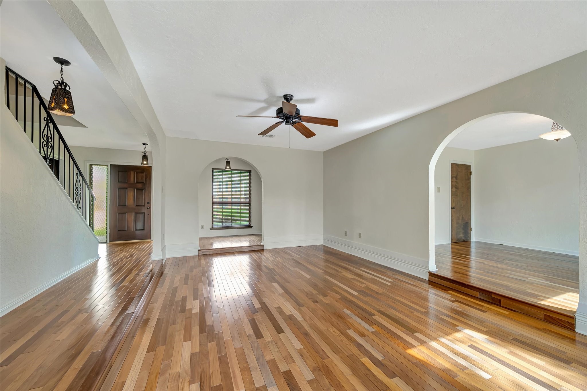 822 Devonport Lane Seabrook, TX 77586 - Photo 16 of 50 a view of empty room with wooden floor and fan