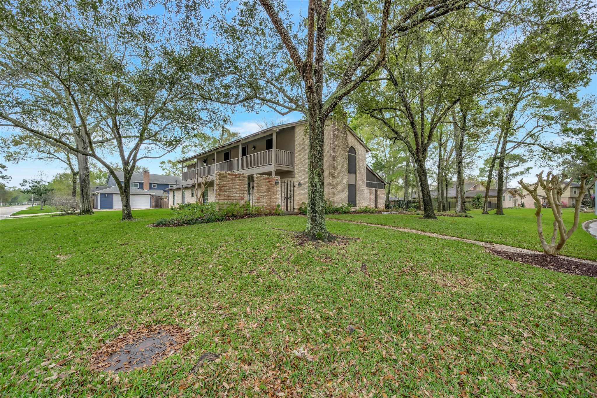 822 Devonport Lane Seabrook, TX 77586 - Photo 2 of 50 a house that has a tree in front of a house