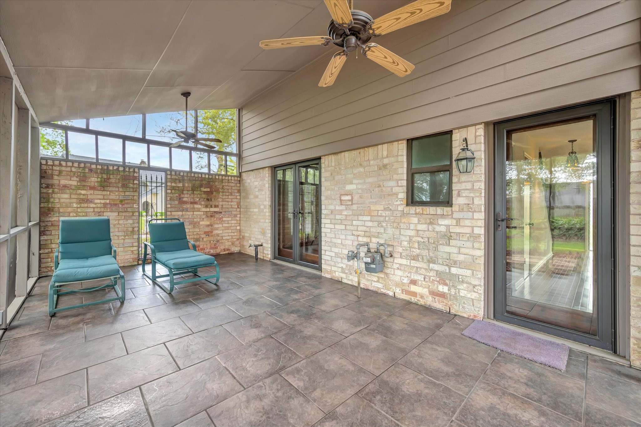 822 Devonport Lane Seabrook, TX 77586 - Photo 21 of 50 a view of a porch with chairs and a grill