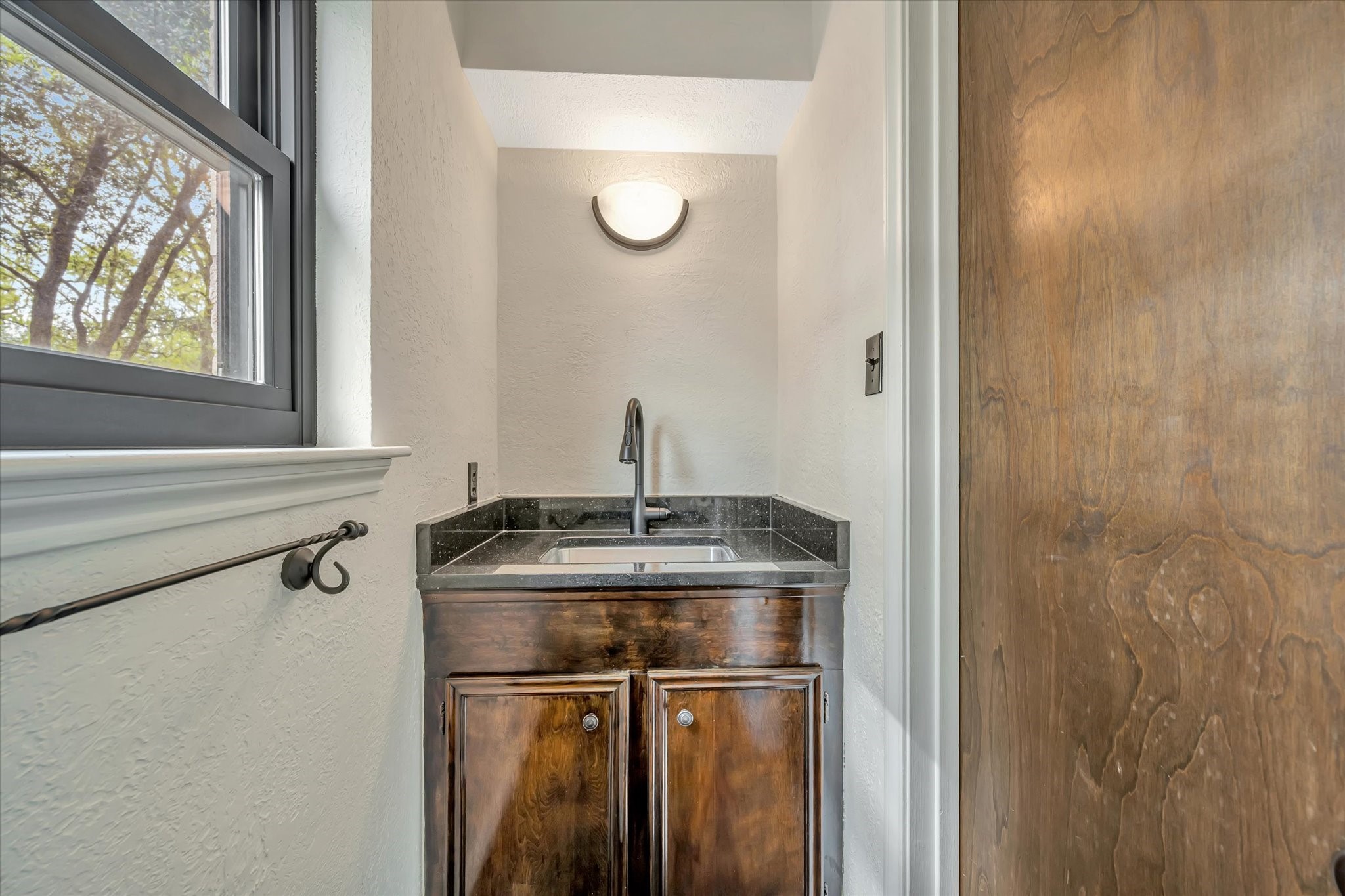 822 Devonport Lane Seabrook, TX 77586 - Photo 28 of 50 a bathroom with a granite countertop sink a toilet and a window