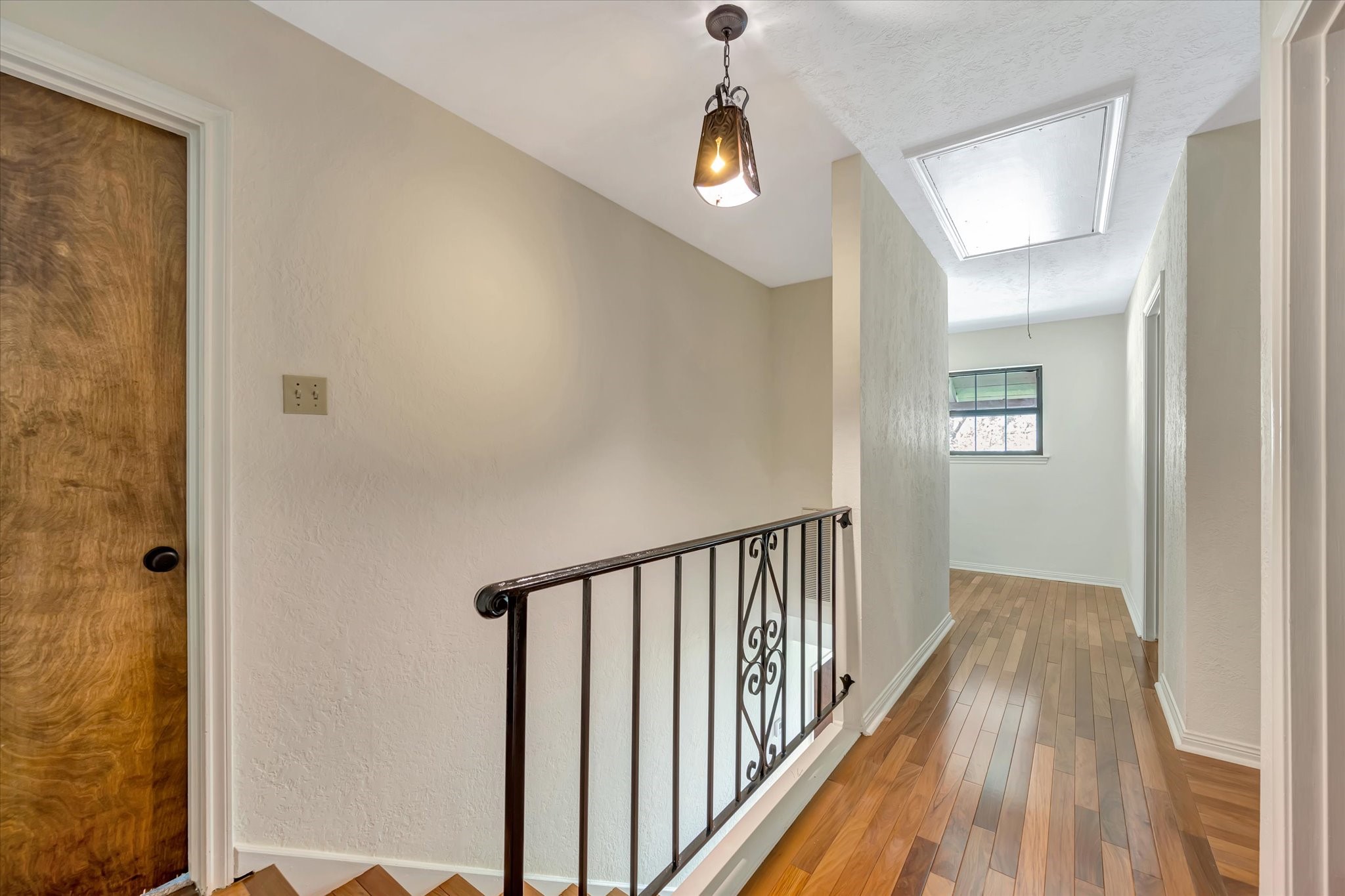 822 Devonport Lane Seabrook, TX 77586 - Photo 30 of 50 a view of a hallway with wooden floor and a bathroom