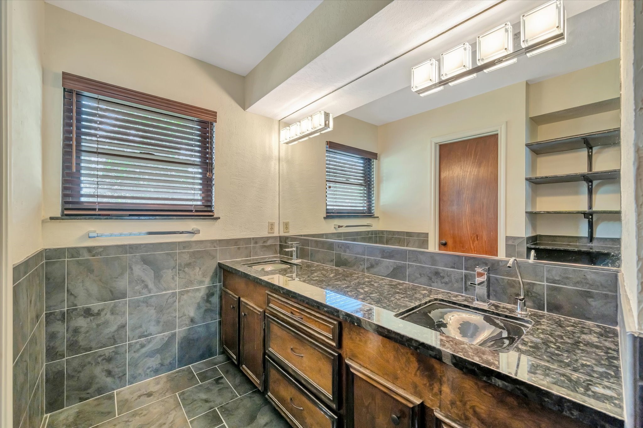 822 Devonport Lane Seabrook, TX 77586 - Photo 41 of 50 a bathroom with a granite countertop sink and a mirror