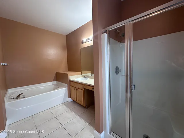 a bathroom with a bathtub and a sink