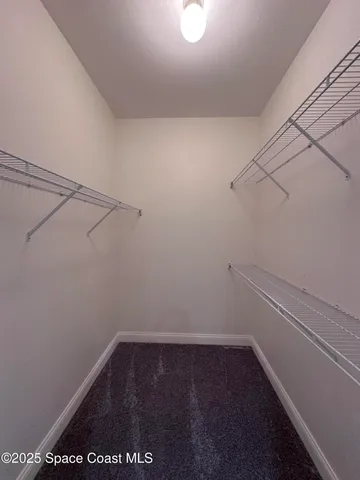 a view of a room with racks on the wall